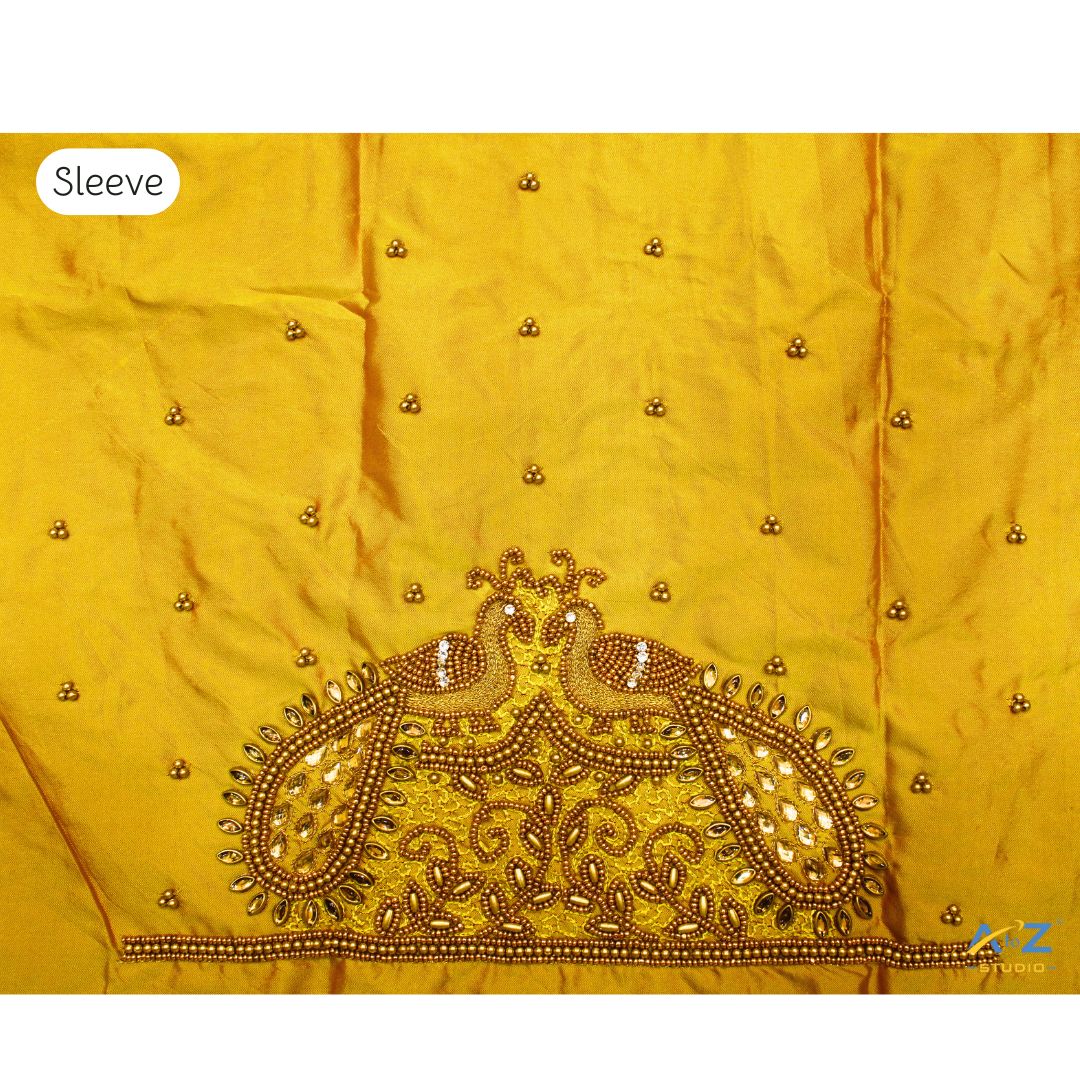 Yellow Maggam Work Blouse Sleeve with Twin Peacock Embroidery – Latest Bridal Blouse Design 2025