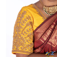Light yellow Silk Cloth Blouse with Small leaf (like flower pot) and chain work Design