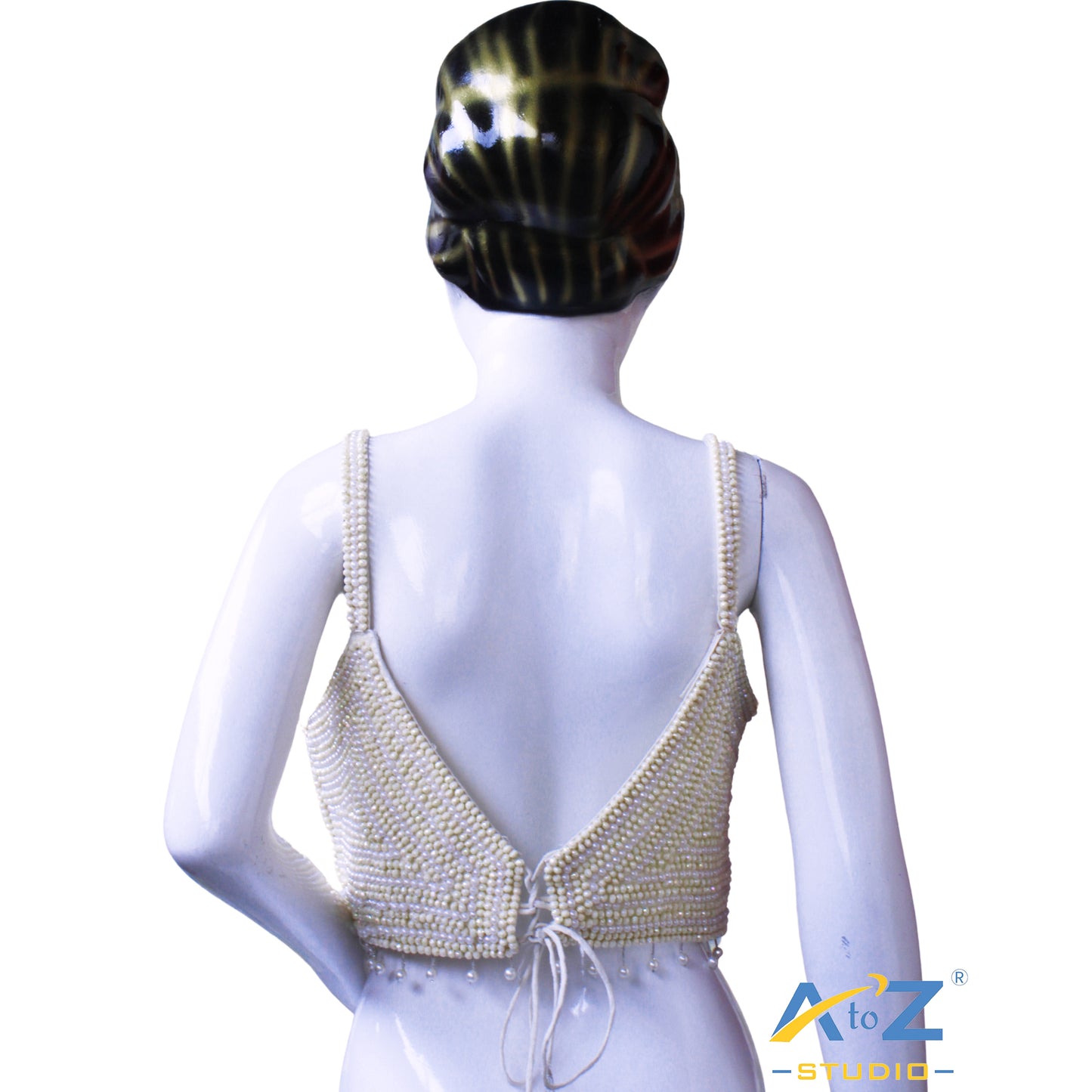 Pearl work white and Yellow pearls arranged in concentric circular patterns