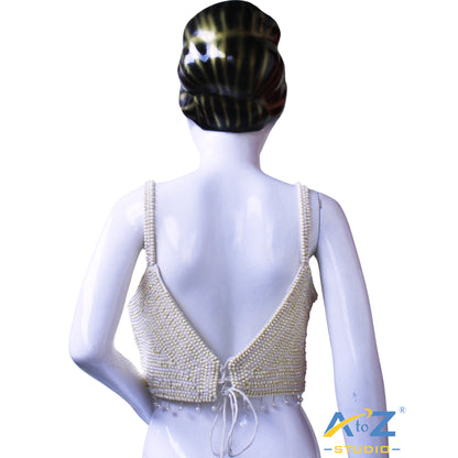 Pearl work white and Yellow pearls arranged in concentric circular patterns